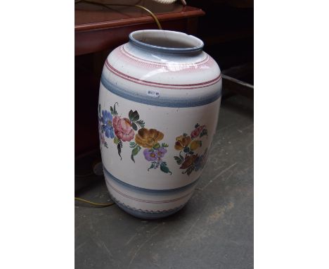 A standing lamp with metal base and cream shade, a table lamp with floral ginger jar ceramic base and a large ceramic urn tog