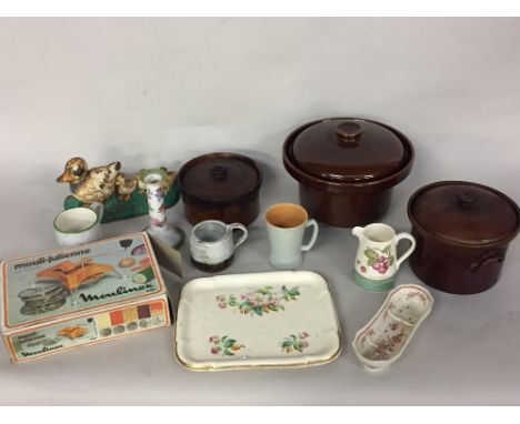 A mix lot of kitchenware including a Mouli-Julienne from Moulinex in original packaging, three brown casseroles dish with lid