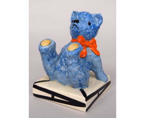 A Clarice Cliff Teddy Bear Bookend, the Bear painted in blue with an orange bow, and on a square base with letter 'A'. Base m