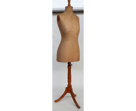 A vintage tailors dummy cloth covered torso on wooden stand