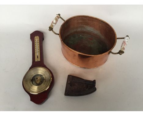 A copper pot with floral ceramic handles, a banjo barometer and a small vintage iron