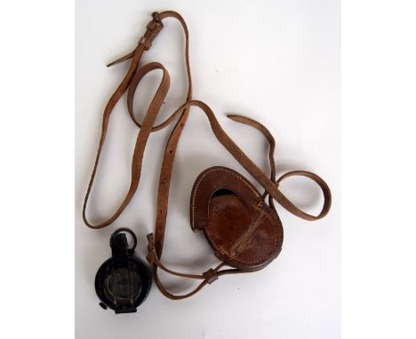 A WWII military compass the leather case stamped F. Limited 1944 made by T.G.Co Ltd. London no. B29174 1940 MKIII 2nd Perival