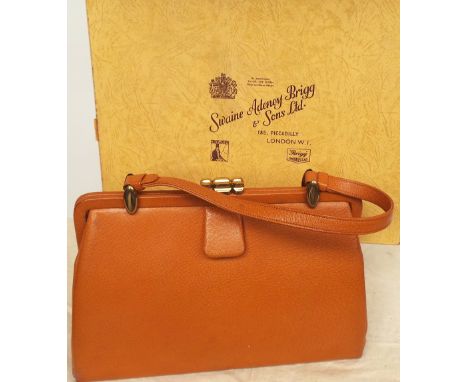 Two  leather vintage handbags. A tan leather and suede lined bag with brass clasp and fittings, matching purse inside and lab