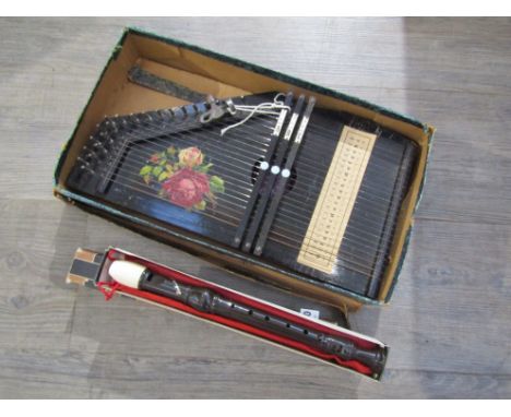 A boxed auto harp together with a recorder and tuition book 
