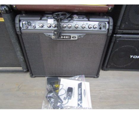 A Line 6 Spider Jam modelling amplifier together with instruction manual and accessories