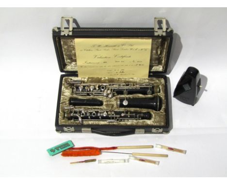 An early 20th Century Christian Reisser of Ulm, Germany oboe in African Blackwood, cased with accessories. A Taktell Piccolo 