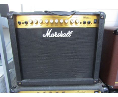 A Marshall MG30 DFX electric guitar amplifier