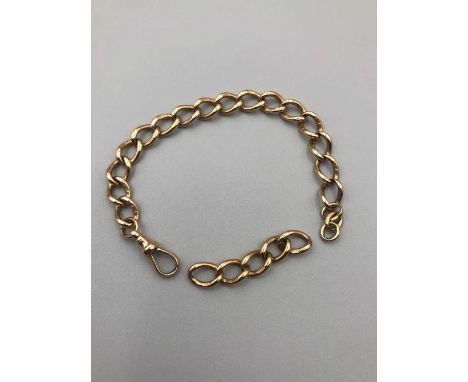 A vintage 9ct gold curb bracelet with a dog tooth clasp and five spare links. Length 18cms and spare links 5cms. Gross weight