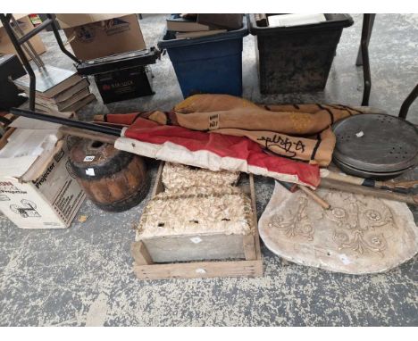 A large decorative museum type plater cast panel, a flag, a projector, a wheelhub etc.