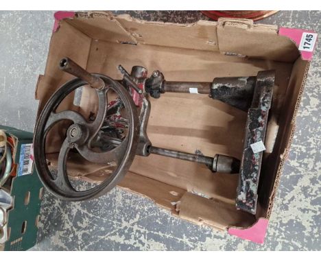A vintage hand cranked piller drill.