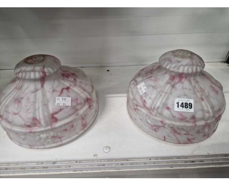 A pair of purple mottled white glass light shades