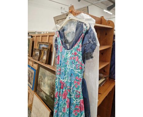 A John Charles blue satin vintage evening dress and other vintage dresses.