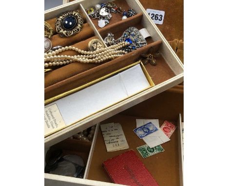 A vintage jewellery box and contents to include a 9ct and silver three-stone ring, a silver bracelet and a quantity of enamel