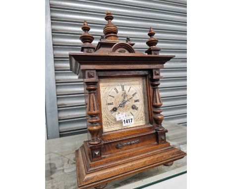 A Junghans mantel clock striking on a coiled rod