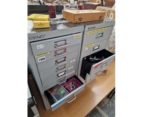 A bergeon watchmakers case back remover and two file cabinets of watchmakers tools and supplies.