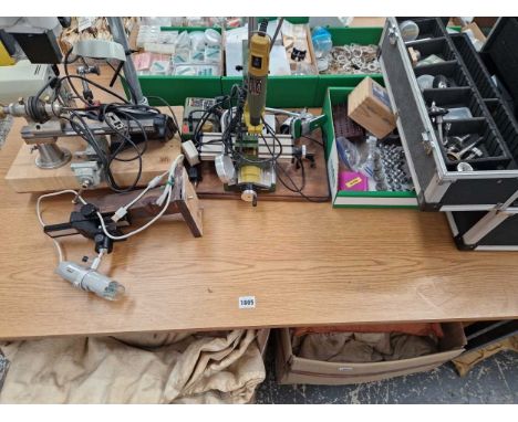 A watchmakers lathe, collets and other related tools.