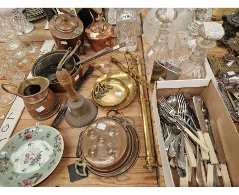 A nest of copper saucepans, a brass balance scale arm, various cutlery, decanters, a Canton plate, etc.