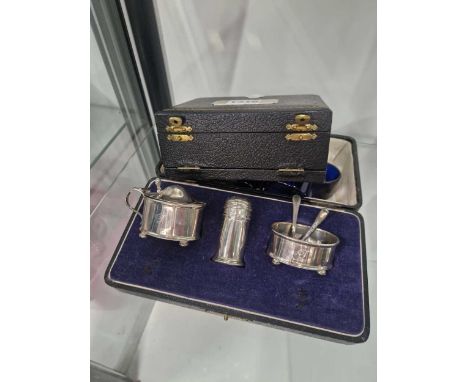 Hallmarked silver cased cruet. Gross weight 87 grams and a silver-backed comb and brush set.
