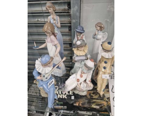 Eight Lladro and Nao figurines