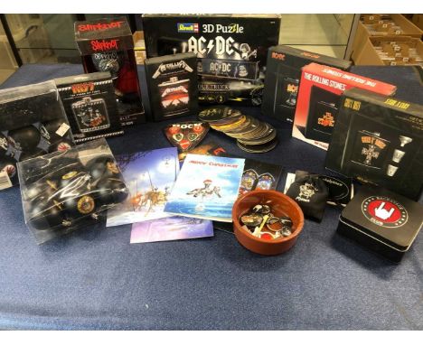 A collection of rock memorabillia ; AC/DC, Metallica, Kiss, Guns 'n' roses, Rolling Stones hip flasks, Motorhead phones, Ac/D