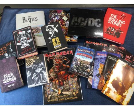 A collection of rock books, magazines, tour programmes etc. including; Guns 'n' roses, The rolling stones, Ac/Dc, Dire Strait