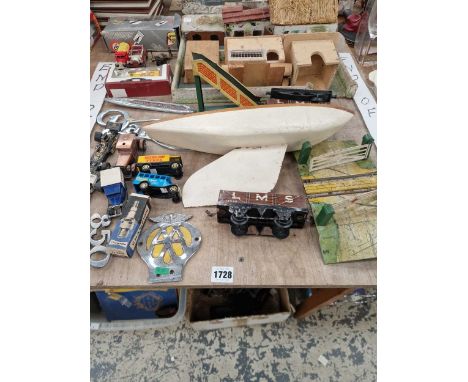 Tin plate and die cast toys, a box of books, vintage boot polishes etc.