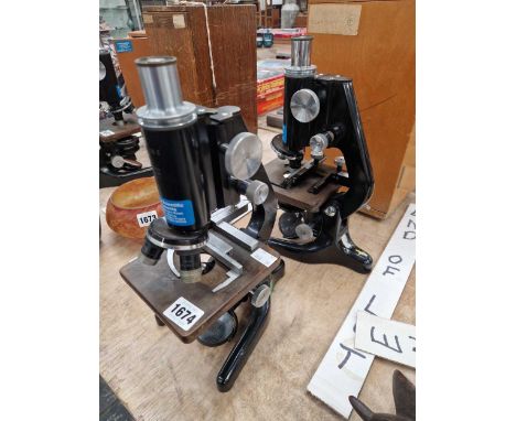 Two vintage microscopes.