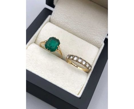 A vintage 9ct stamped green stone set ring together with a 9ct hallmarked gold seven stone half eternity ring. Finger size J.