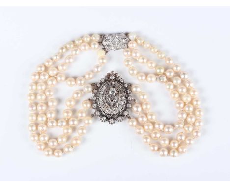 A diamond and cultured pearl three row necklace, the front with an oval diamond set panel centred by the principal cushion sh
