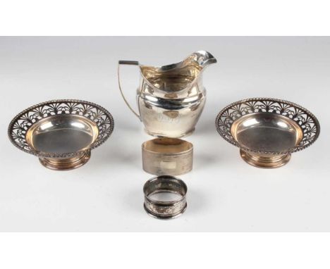 A George III silver cream jug of oval squat baluster form with reeded rim and handle, monogram engraved, London 1806 by Willi