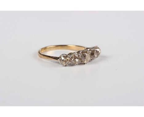 A gold, platinum and diamond five stone ring, claw set with a row of graduated cushion shaped diamonds, detailed ‘18ct PLAT’,