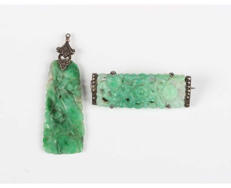 A Chinese jadeite pendant of tapered rectangular form, carved in relief with fruit, fitted with a silver and marcasite mount,