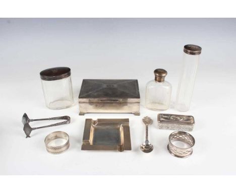 A George V silver rectangular cigarette box with engine turned hinged lid, Birmingham 1930, length 14cm, and a small group of