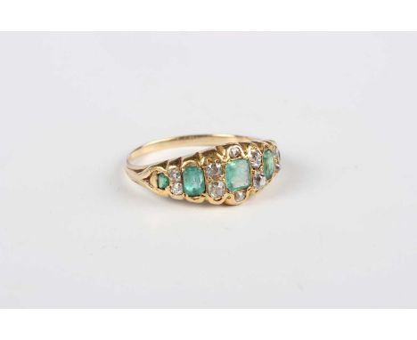 A gold ring, mounted with five graduated emeralds and ten cushion shaped diamonds, unmarked, weight 4.3g, ring size approx R.