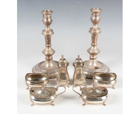 A pair of Elizabeth II silver candlesticks, each girdled urn shaped sconce above a knop stem, on a circular stepped base, Bir