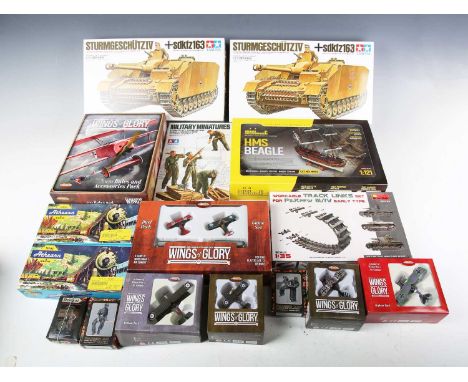 A group of model kits, including two Tamiya plastic 1:35 scale model kits of Sturmgeschutz IV sdktz 163 armoured tanks, ammo 