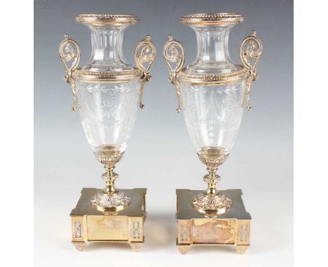 A pair of 19th century French plate mounted cut glass vases, each urn shaped body mounted with scroll handles, on a knop stem