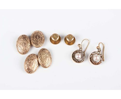 A pair of 9ct gold cufflinks, the oval backs and fronts with engraved decoration, Birmingham probably 1894, a pair of 9ct gol