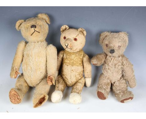 A wood straw-filled mohair humpback teddy bear with stitched horizontal nose and jointed body, height 41cm (lacking eyes, bal