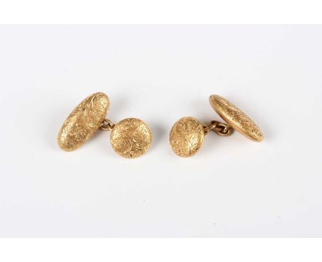 A pair of gold cufflinks, each with a circular front and oval back, with engraved feather spray decoration, detailed ‘18ct’, 