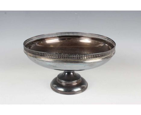 A George V silver circular tazza, the centre presentation inscribed within a pierced rim, on a tapering stem and circular ree