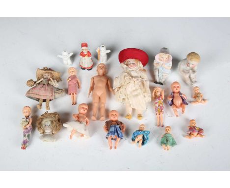 A bisque head doll's house doll with blonde wig, sleeping blue eyes, painted features and jointed composition body, height 12