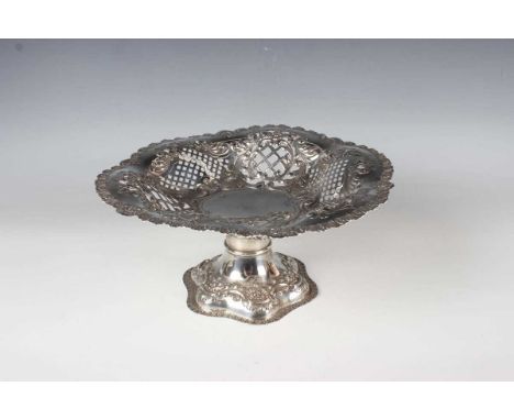 An Edwardian silver circular tazza, the lobed bowl pierced and embossed with lattice and foliate scroll decoration, raised on