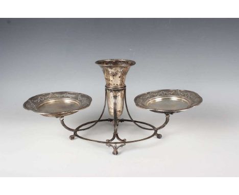 A George V silver epergne, the central trumpet vase flanked by two circular dishes, each pierced and engraved with floral gar