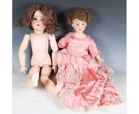A Simon &amp; Halbig bisque head doll, impressed ‘58’, with later brown wig, sleeping blue eyes, open mouth showing upper tee