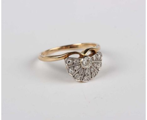 A gold and diamond ring with Art Deco fan motif, mounted with circular cut diamonds, marks worn, weight 2.2g, ring size appro