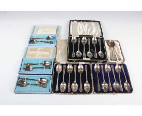 A set of twelve George V silver teaspoons, each with crossed golf club terminals, Sheffield 1932 and 1933 by Walker &amp; Hal