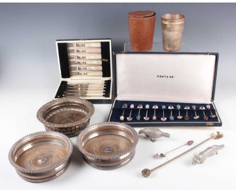 A group of plated items, including a pair of wine coasters with gadrooned rims and part canteens of King's pattern and Fiddle