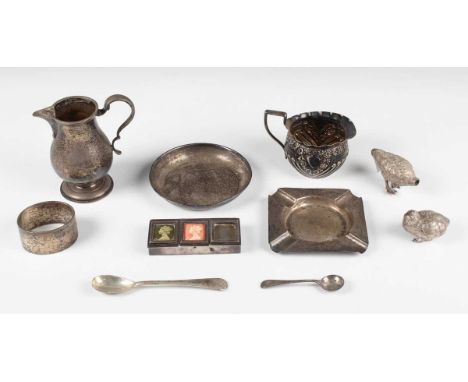 A small group of silver, including a cream jug of squat circular half-spiral reeded form, embossed with flowers, London 1894,