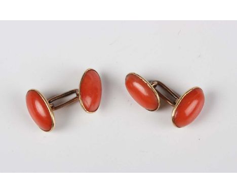 A pair of gold and coral cufflinks, mounted with corals to the oval backs and fronts, unmarked, dimensions of each front and 